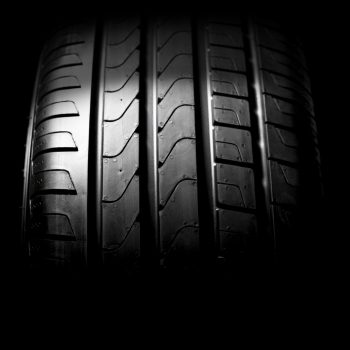 Car tires close-up Winter wheel profile structure on black background